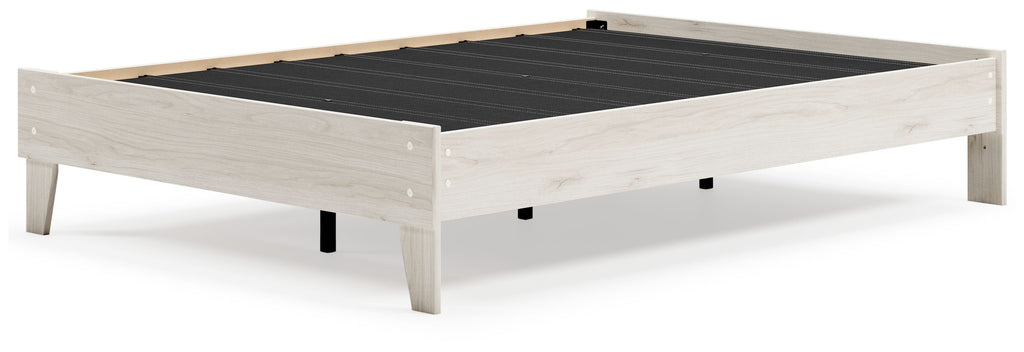 Platform bed with light wood frame and black slatted support panel, top view