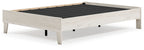 Platform bed with light wood frame and black slatted support panel, top view