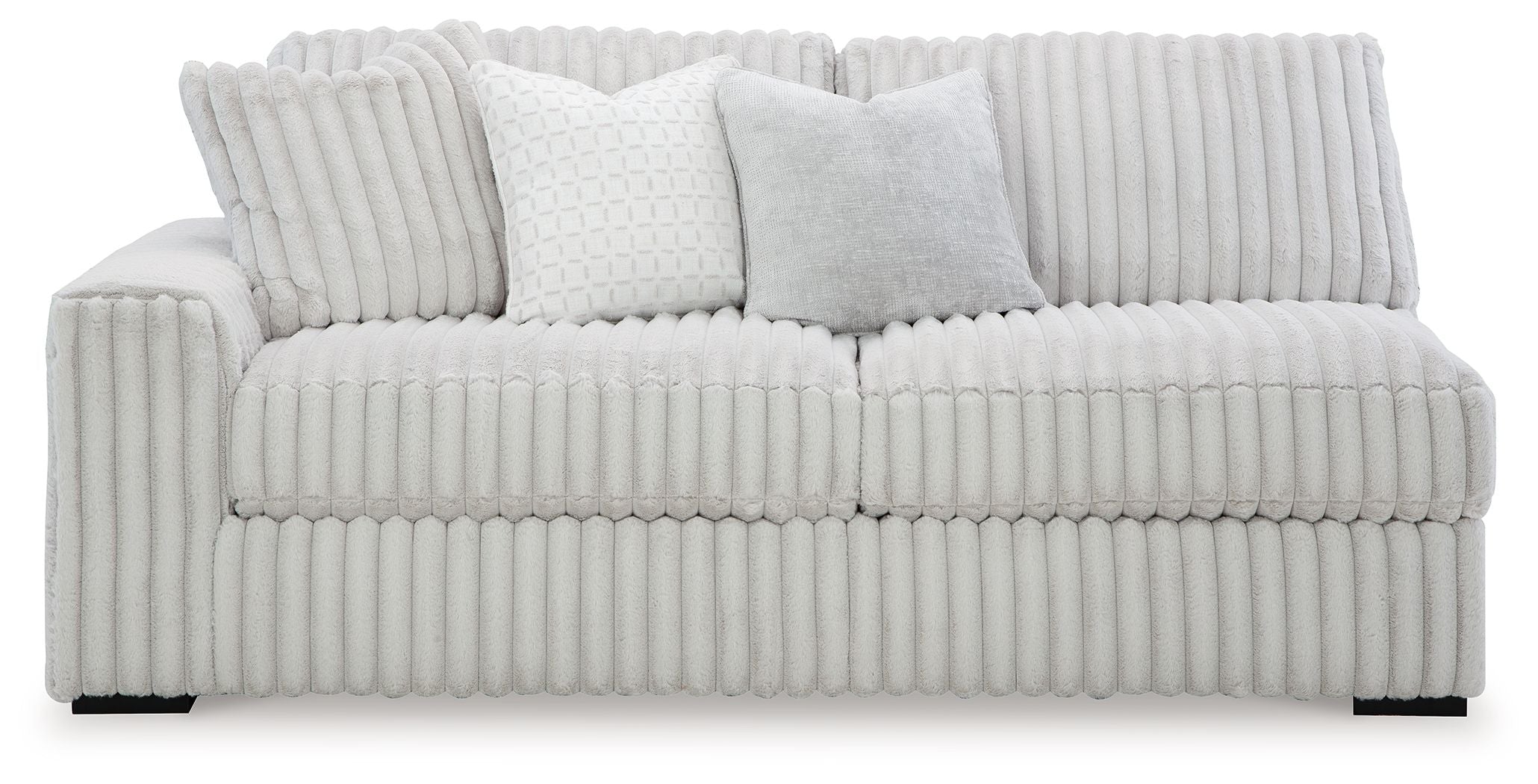 Light gray sofa with ribbed upholstery, rounded arms, and three back cushions