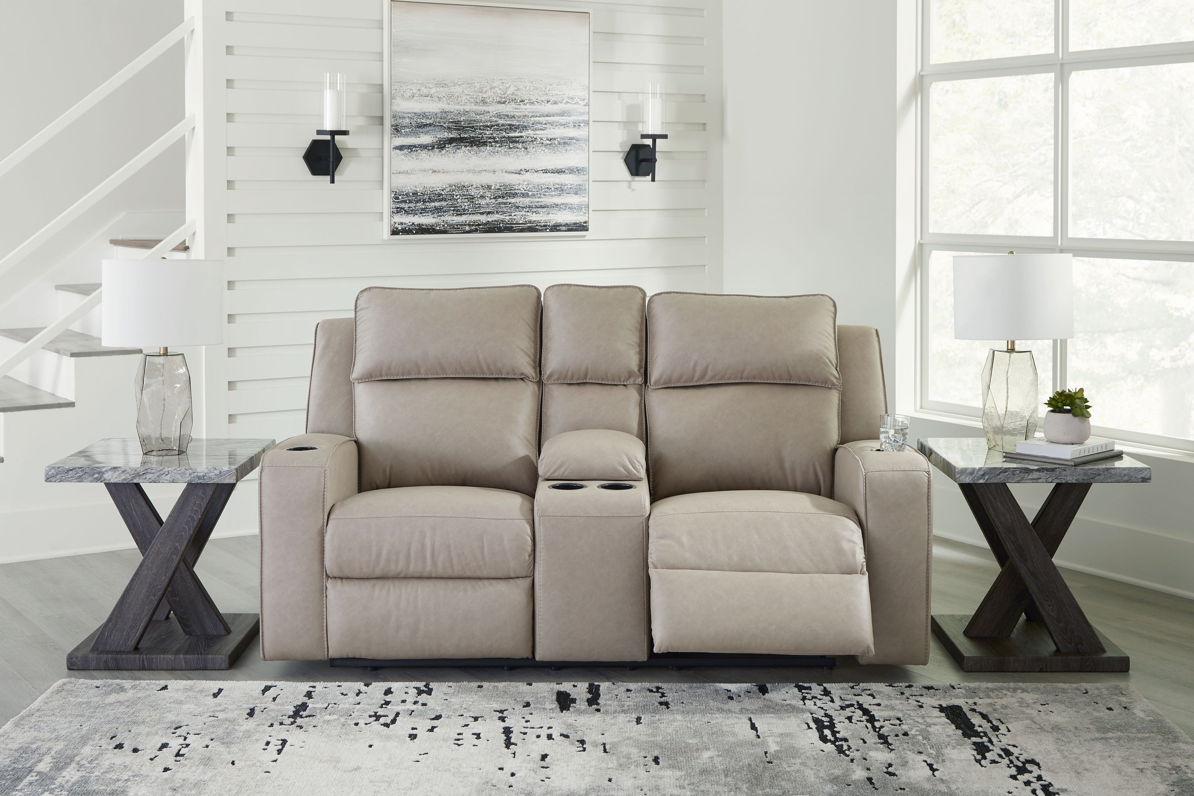 Pebble reclining loveseat with console and plush back cushions, shown from front.