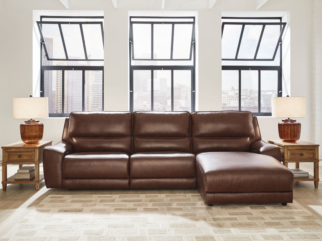Dark brown power reclining sofa sectional with extended chaise and padded headrests