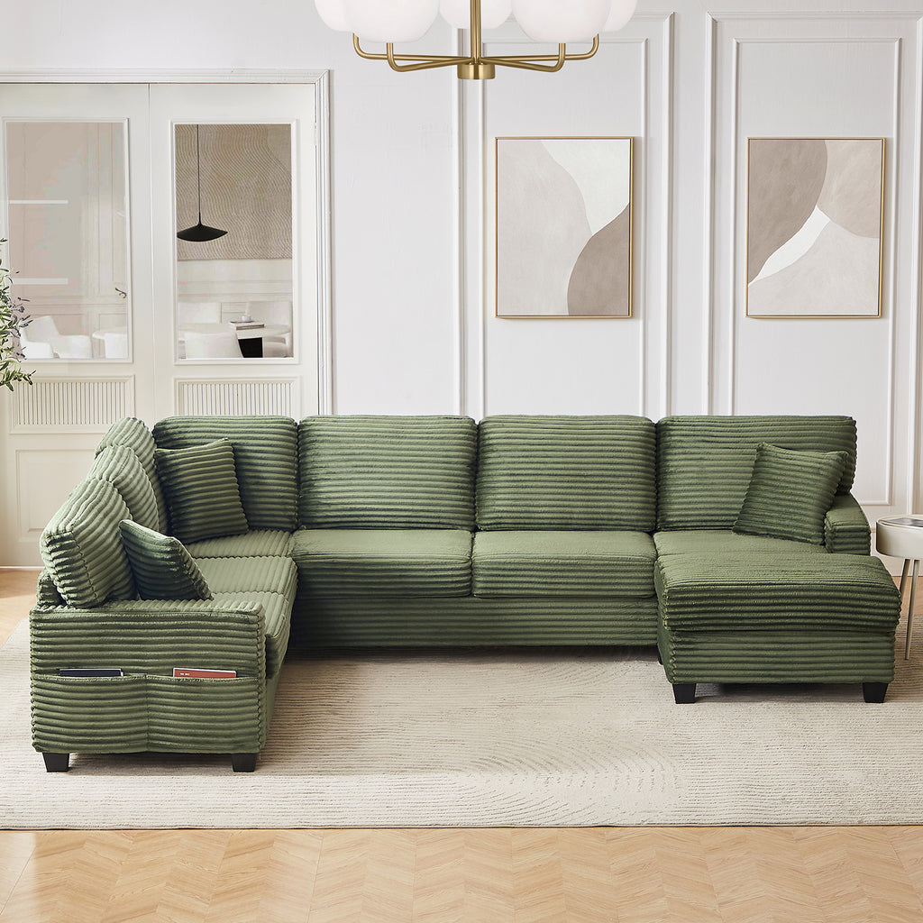Green corduroy sectional sofa with chaise and ottoman, deep seat cushions and pillows
