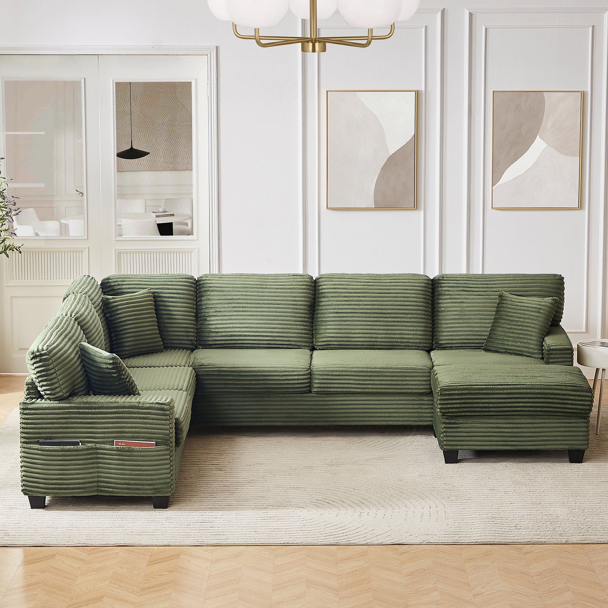 Green corduroy sectional sofa with chaise and ottoman, deep seat cushions and pillows