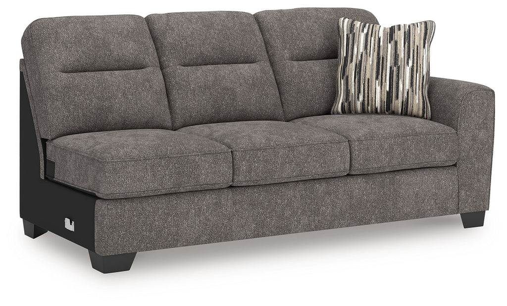Graphite gray fabric sofa with chaise, three seat cushions, striped accent pillow