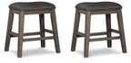 Set of 2 gray upholstered backless stools with padded round seats and wooden legs