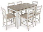 White dining table with light brown top and four bar stools with beige seat cushions