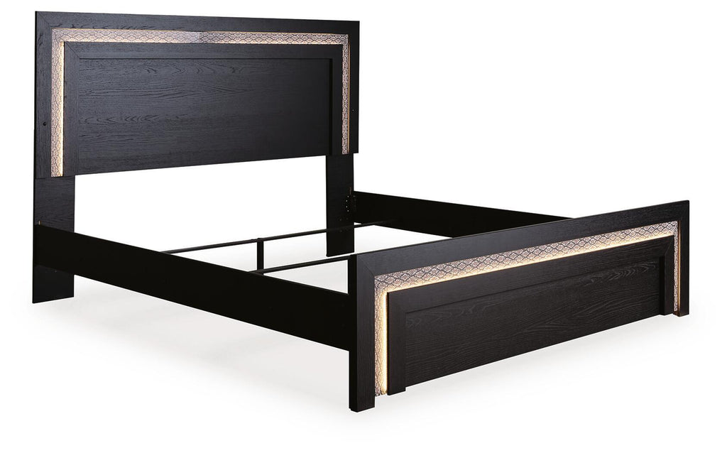Black panel bed with raised frame base and decorative gold-tone trim along edges