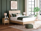 Beige panel bed with white mattress and green upholstered bedding
