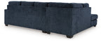 Dark navy fabric sectional sofa with corner chaise and tufted back cushions