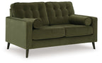 Olive green tufted loveseat with rounded arms and two bolster pillows, dark tapered legs.