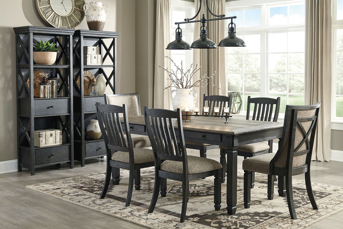 Dark gray dining table with four slat-back chairs and two upholstered benches