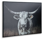 Framed wall art featuring a close-up white cow face with long horns on dark