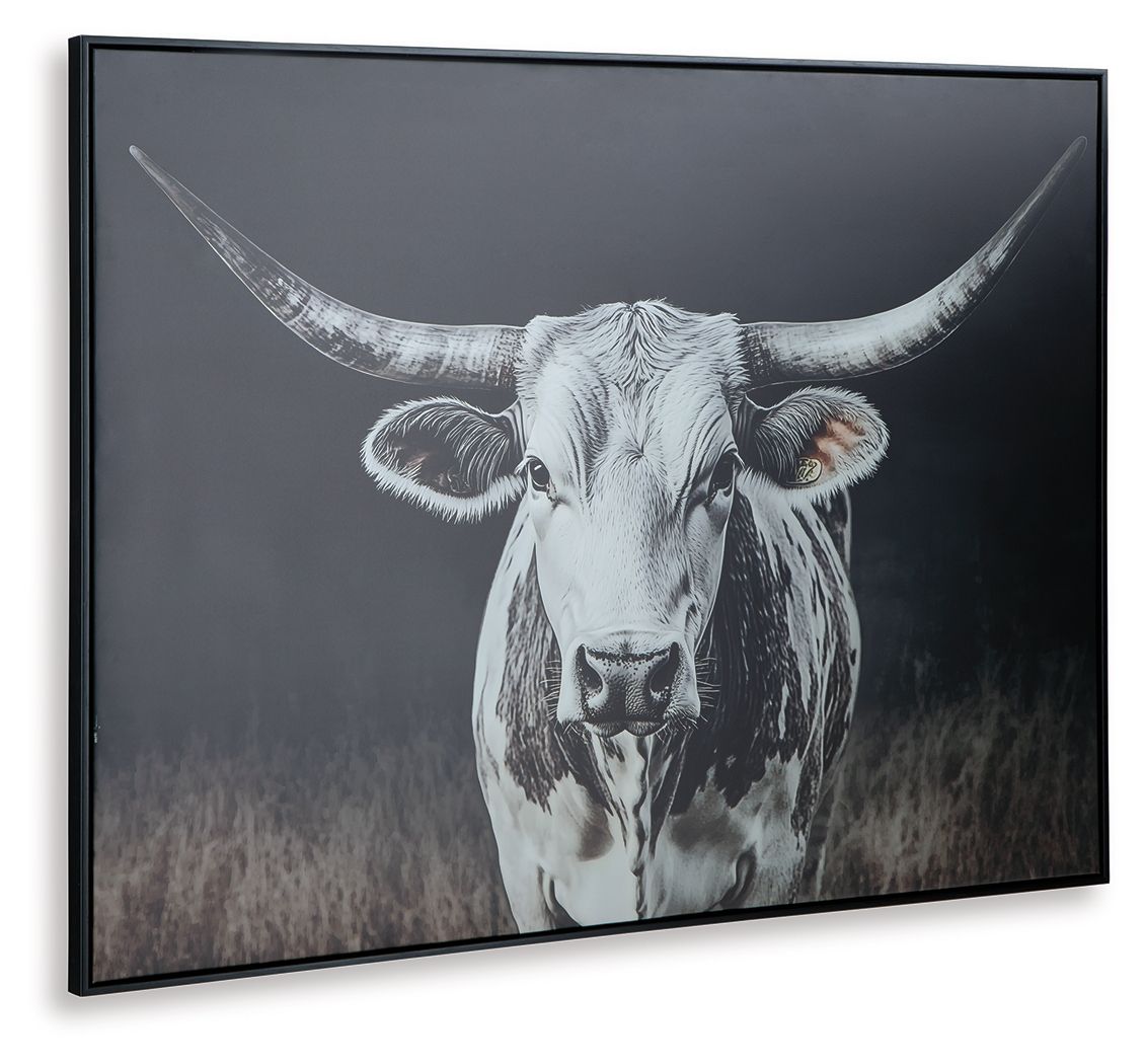 Framed wall art featuring a close-up white cow face with long horns on dark