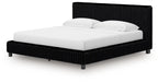 Upholstered bed with black ribbed headboard, black base, white mattress and pillows