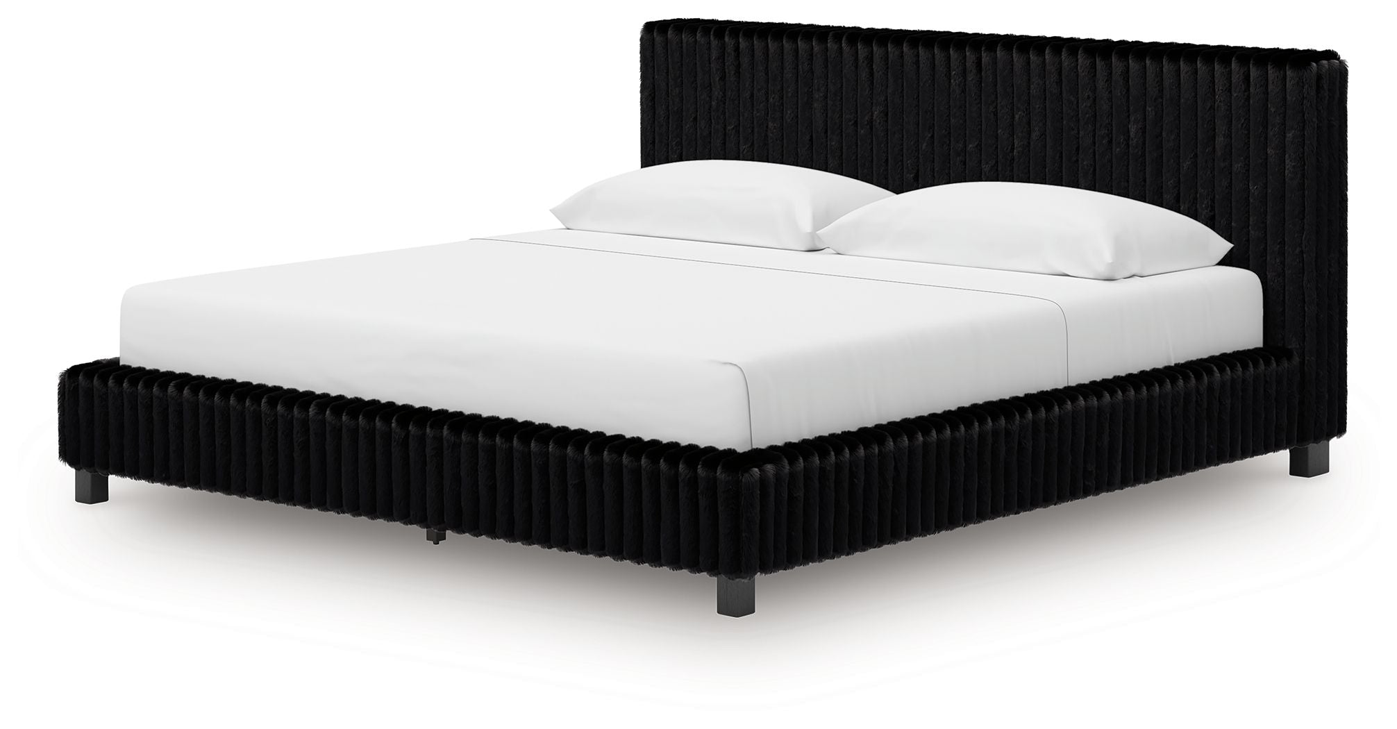 Upholstered bed with black ribbed headboard, black base, white mattress and pillows