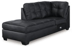 Dark carbon corner chaise with tufted back cushions and square armrests