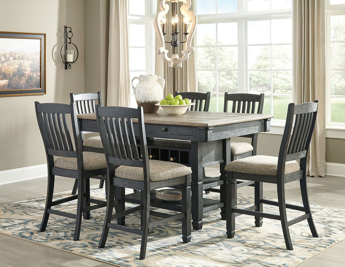 Dark gray counter height dining table with bar stools and open shelf base