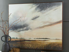 Framed landscape wall art showing wheat field under stormy clouds