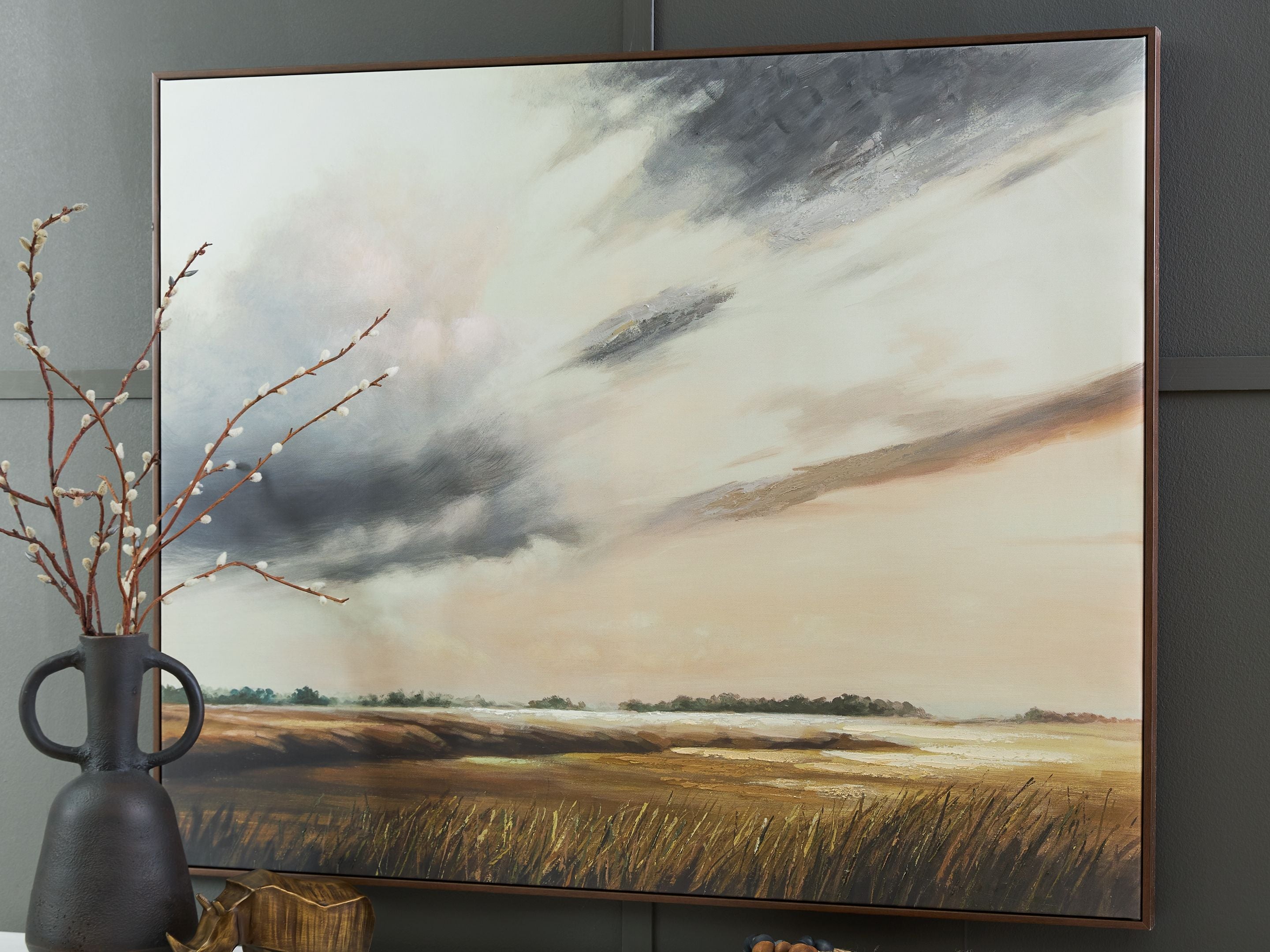 Framed landscape wall art showing wheat field under stormy clouds