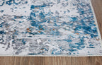 Blue and white abstract rug corner with low-profile woven texture