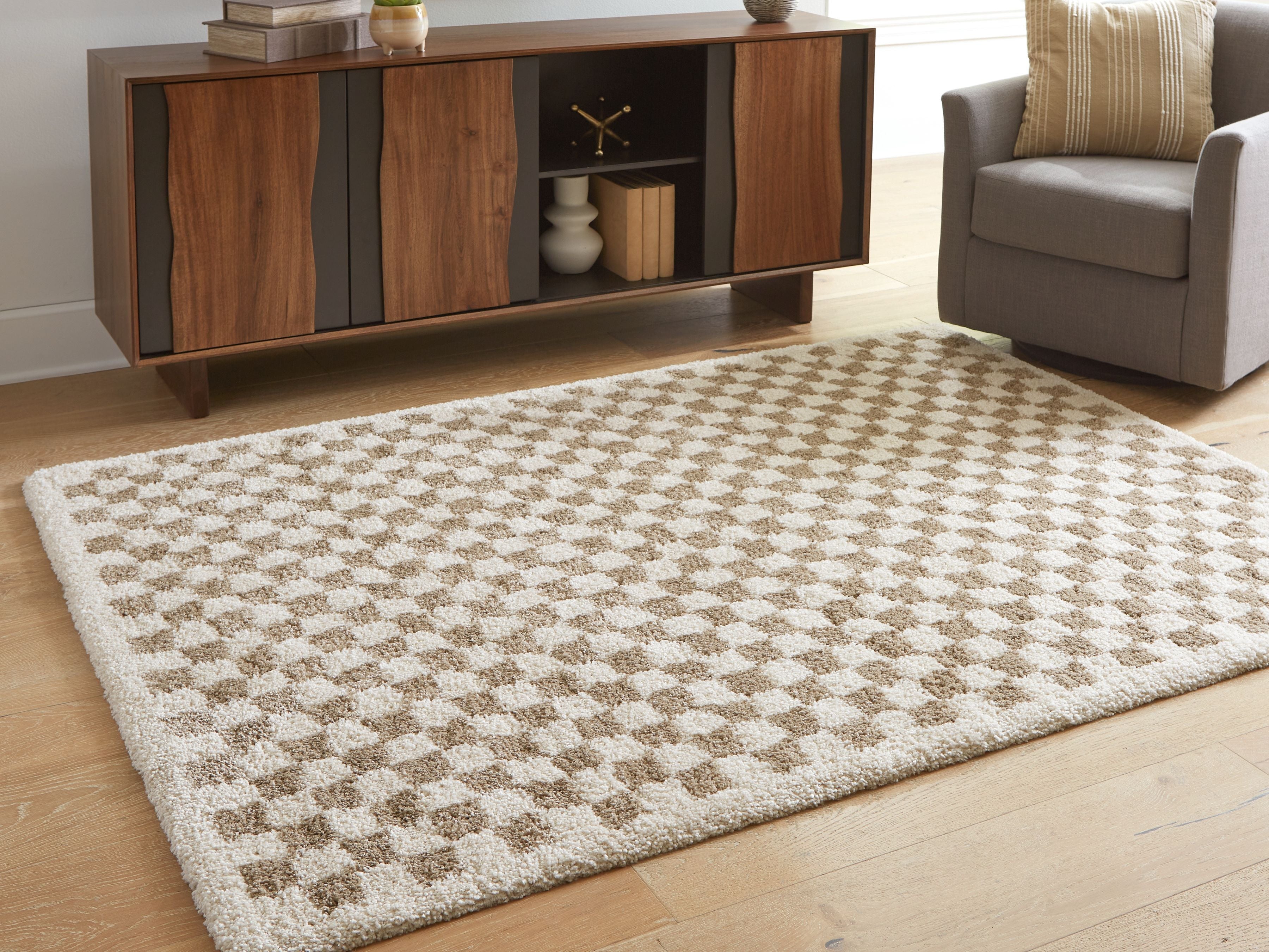Beige rug with diamond check pattern, corner view