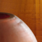 Embersen vase close-up texture, dark brown woven pattern with glossy highlights