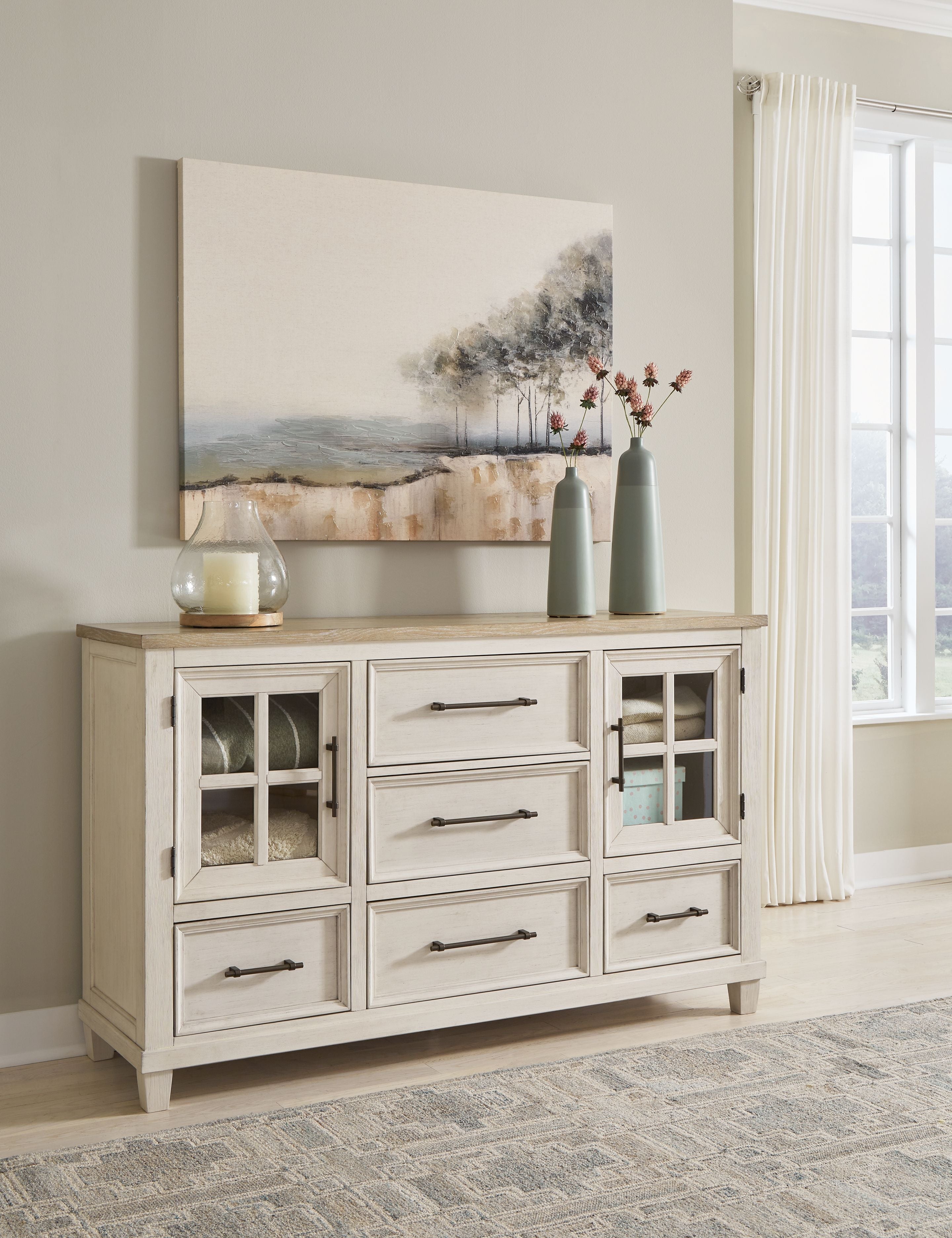 Antique-style dresser in antique white with brown top, glass-front doors and drawers