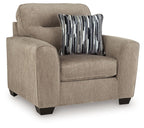 Light brown accent chair with padded arms and a striped throw pillow