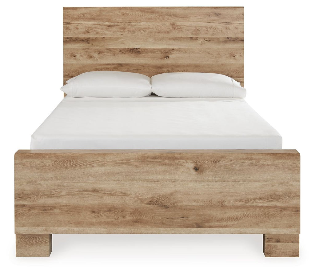 Beige storage bed with two front drawers and a white mattress and pillows