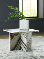 Accent cocktail table with veined white marble-look top and angled pedestal base
