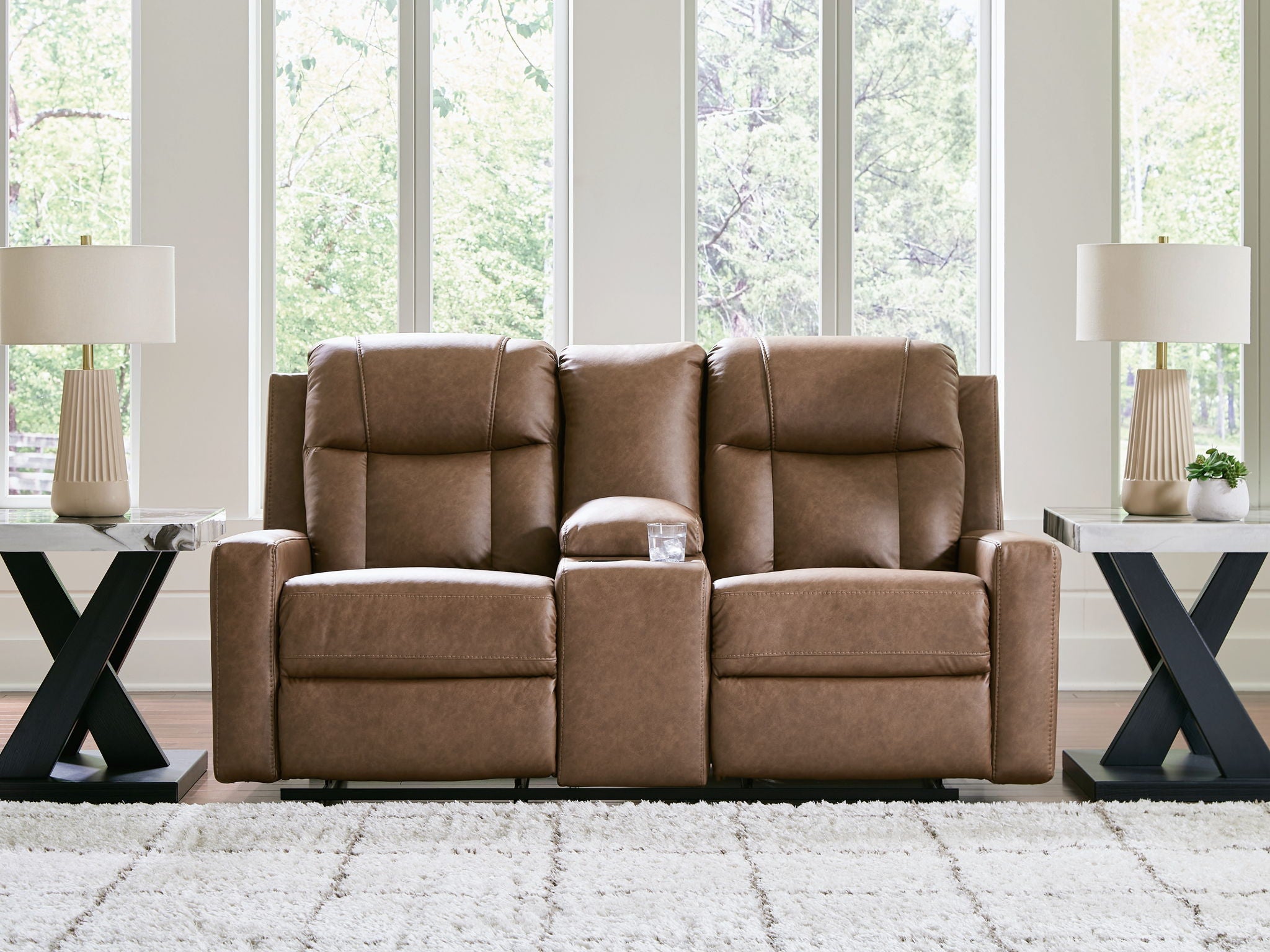 Light brown double reclining loveseat with center console in a living room setting
