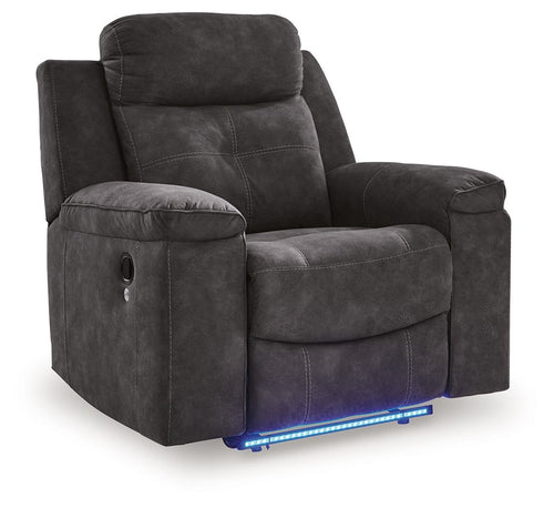 Charcoal zero-wall recliner angled view with padded headrest, armrests, and seat/leg rest