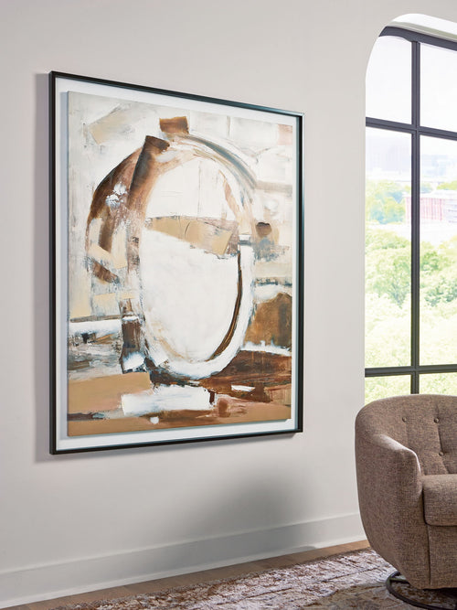 Framed abstract wall art with brown, white, and black circular shapes