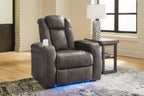 Dark gray power recliner with adjustable headrest and padded armrests