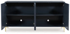 Dark blue accent cabinet with two open shelves, center divider, and gold-tone legs