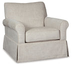 Light beige upholstered swivel glider accent chair with wide arms and cushioned seat.