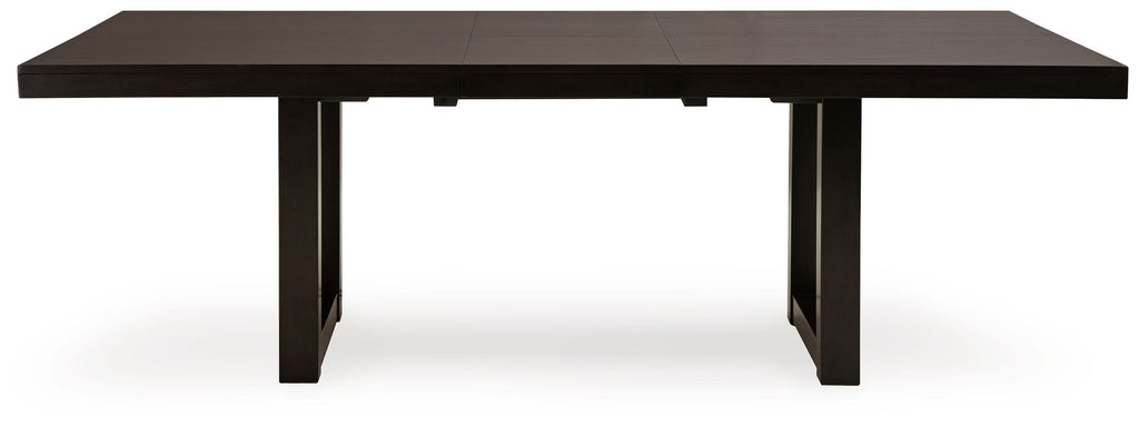 Rectangular dining table with butterfly extension seams, dark gray-brown top and straight legs.