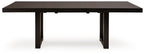 Rectangular dining table with butterfly extension seams, dark gray-brown top and straight legs.