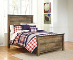 Dark brown panel bed with paneled headboard and plaid bedding, three-quarter view