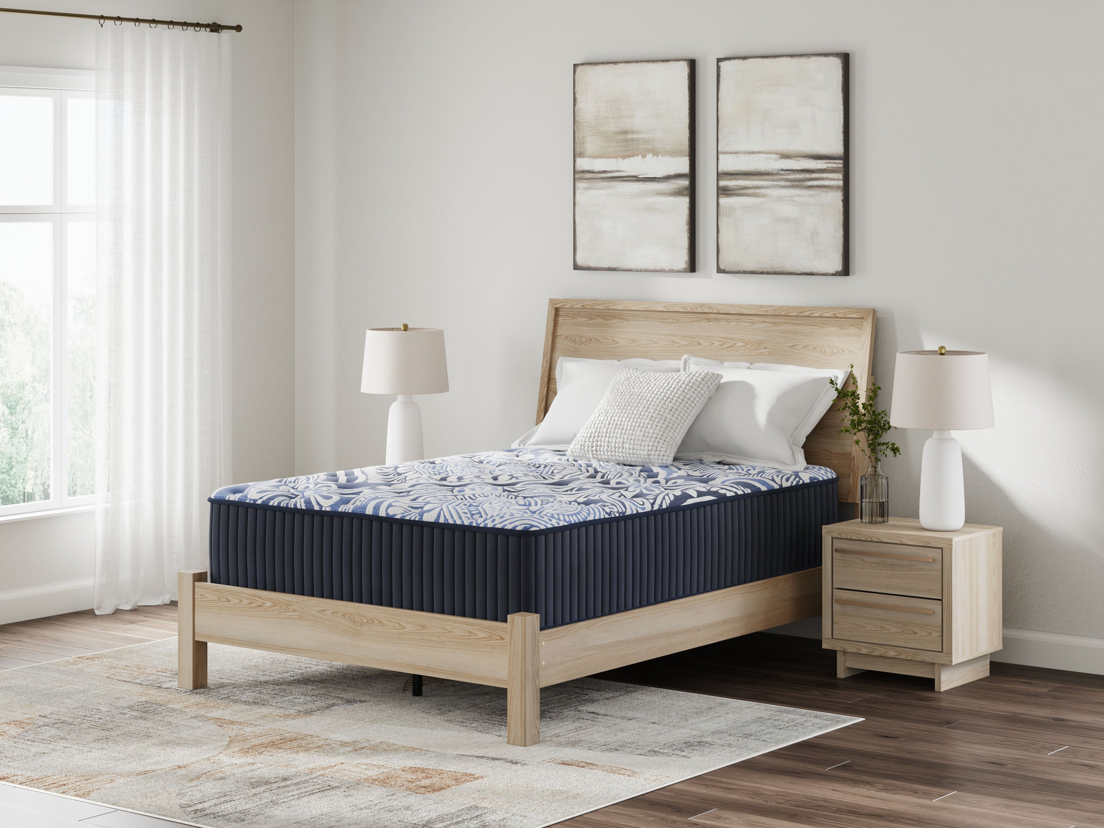 Blue upholstered mattress with navy side panels and blue patterned top