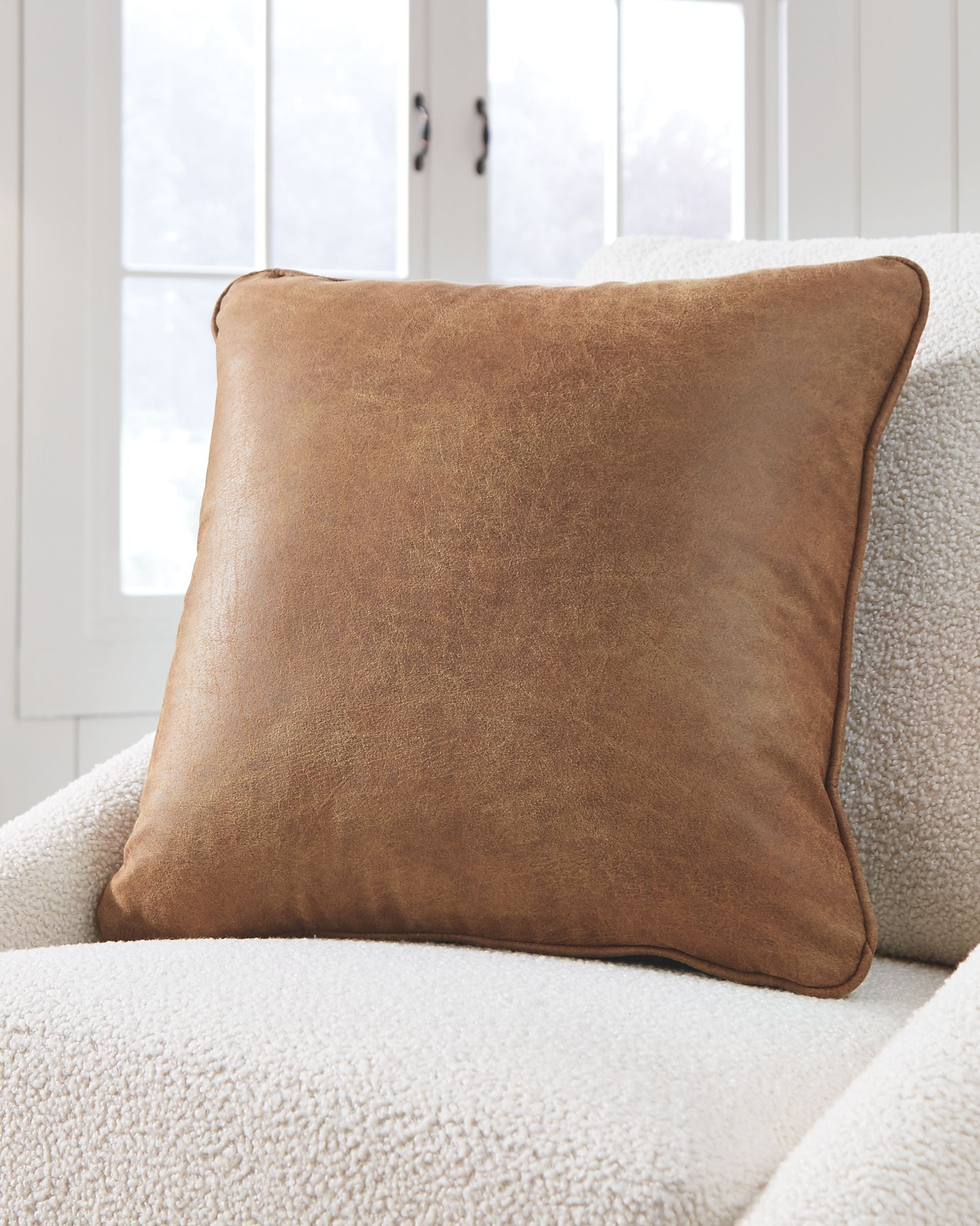 Cortnie light brown square pillow with rounded corners and textured fabric
