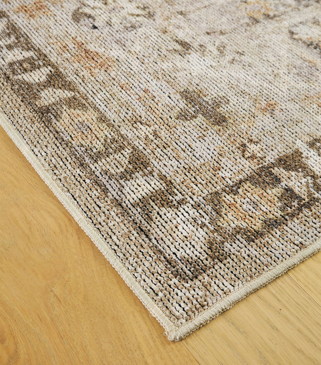 Washable rug corner close-up showing flat woven texture and distressed pattern