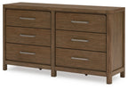 Light brown wooden dresser with six drawers and metal bar pulls, front view