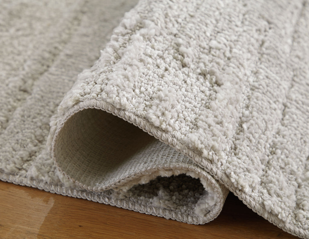Ivygail Rug, light gray looped pile with turned-back edge showing backing