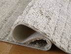 Ivygail Rug, light gray looped pile with turned-back edge showing backing