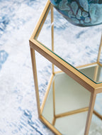 Gold-finish glass panel top and shelf on an octagonal side table