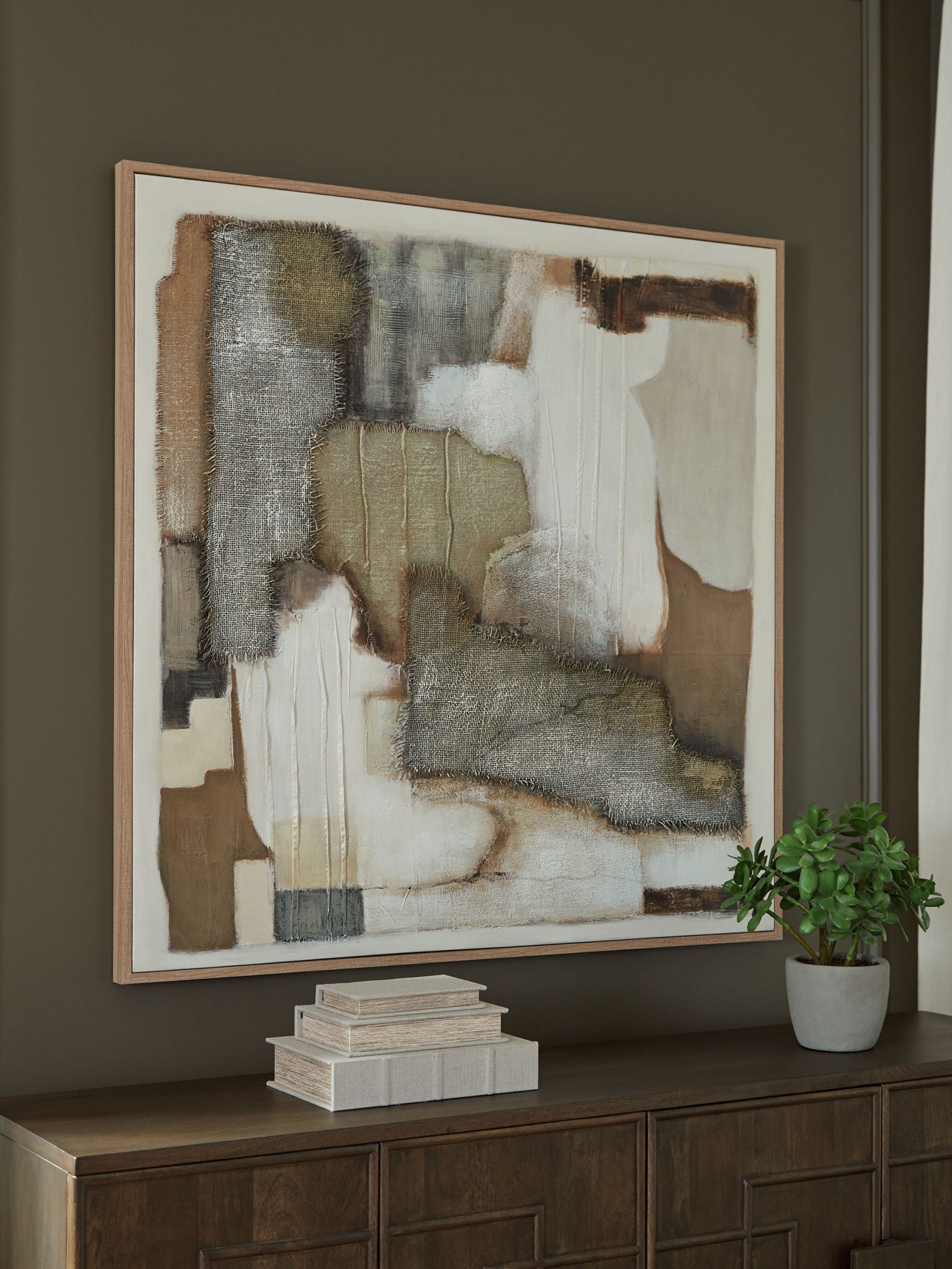 Framed abstract wall art with tan, brown, gray, and white geometric blocks