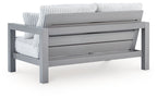 Gray loveseat with back slat panel and ribbed white cushions