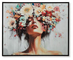 Framed wall art with stylized woman's face, dark hair, and colorful floral collage