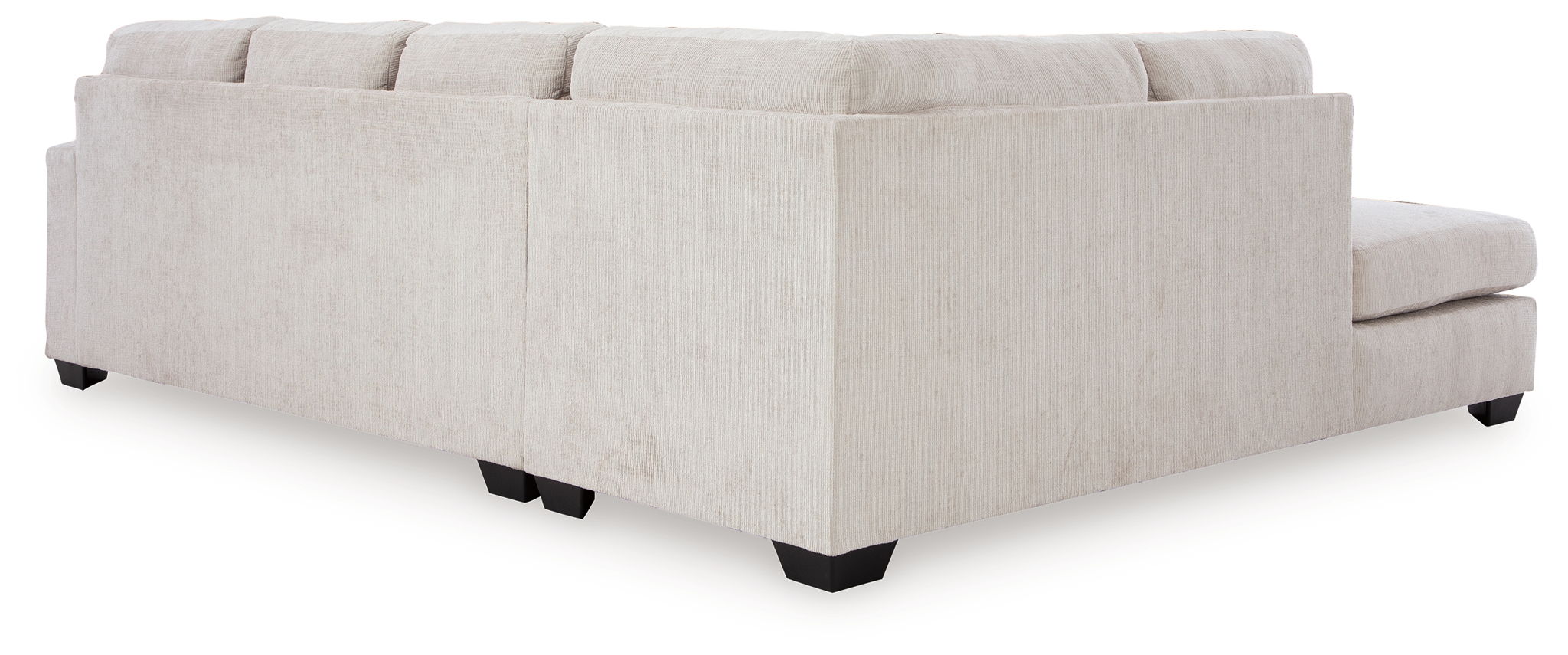 Light beige sectional sofa ottoman and chaise section with back cushions